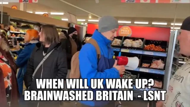 A MAN WALKS AROUND A STORE WITH A MEGAPHONE WAKING PEOPLE UP!