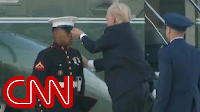 Trump stops to retrieve Marines hat - BUT only he can do it like this!!