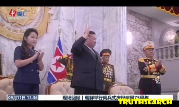 Kim Jong Un watches a parade with his 10 years old daughter